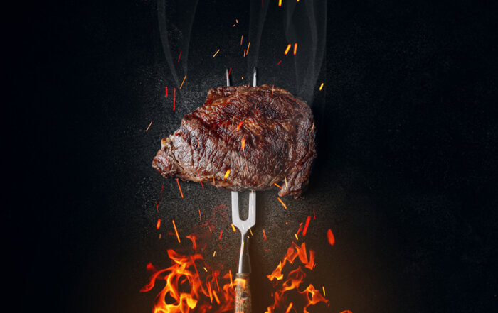 grilled beef steak on a dark background. expensive marbled beef of the highest grade fried to rare on the grill